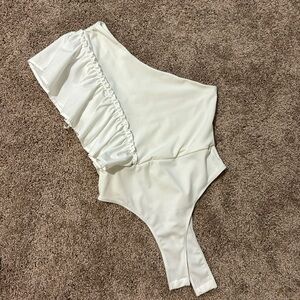 white one should ruffle sleeve body suit